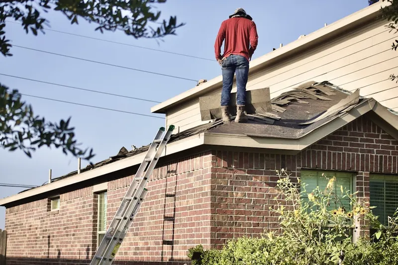 Professional roofer working on a residential roof in Oak Court